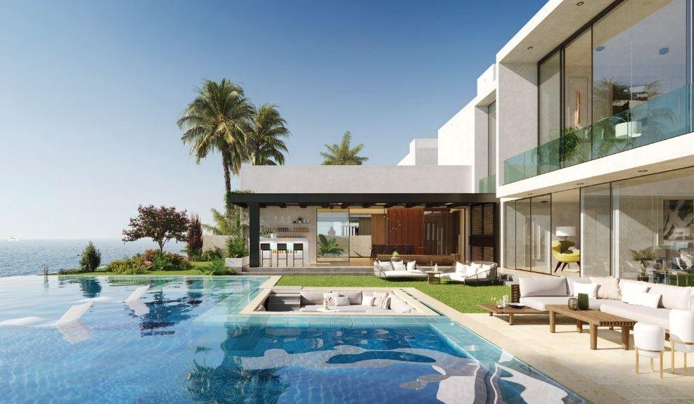 Peaceful waterfront walkways and landscaped open spaces at Al Gurm Villas Abu Dhabi offering a refined lifestyle amidst natural mangrove scenery.