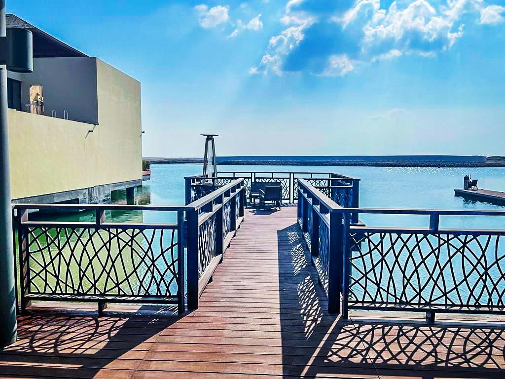 Beautiful Mediterranean-inspired villa at Al Gurm Villas featuring private waterfront frontage, manicured gardens, and premium coastal real estate in Abu Dhabi.